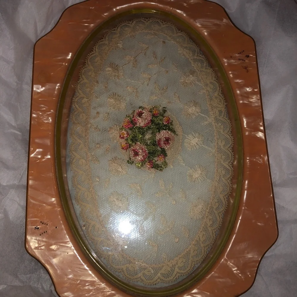 Vintage pearly coral bakelite clear pressed lace tray